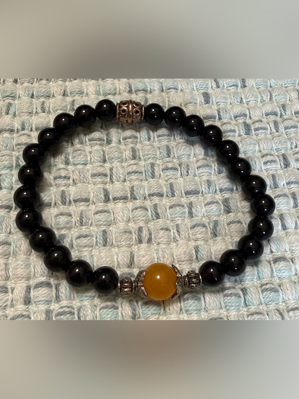Handcrafted Black Bead Bracelet with Amber Centerpiece - Unbranded
